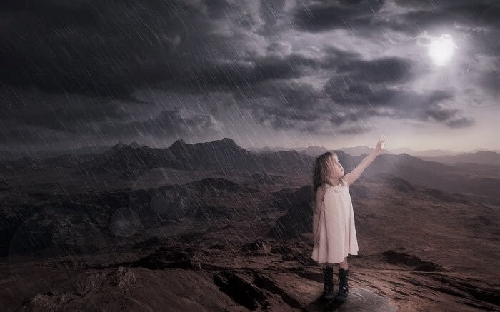 little girl calling out the sun during a storm