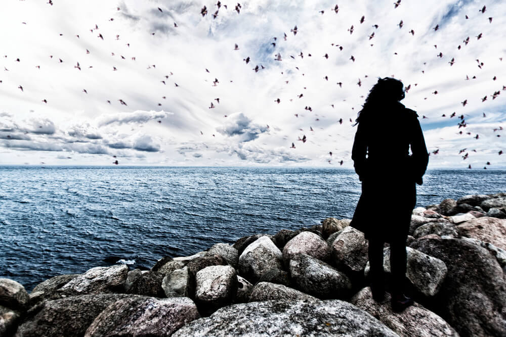 woman with mental illness looking in the horizon