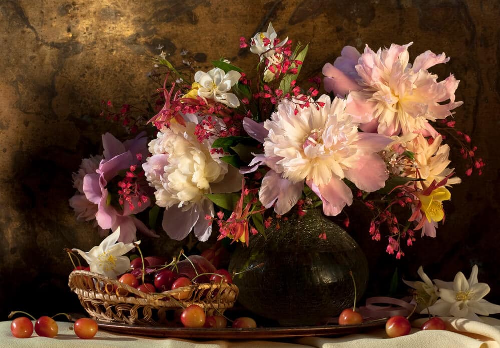 still life oil painting with flowers and cherries on table