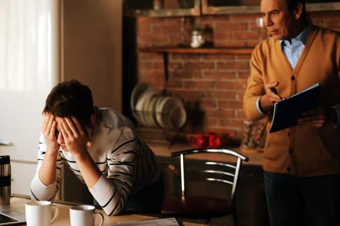 stressed boy with his father