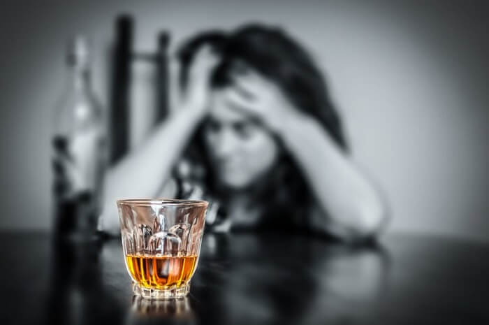 Woman struggling with alcoholism