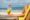 woman at the beach holding a cocktail